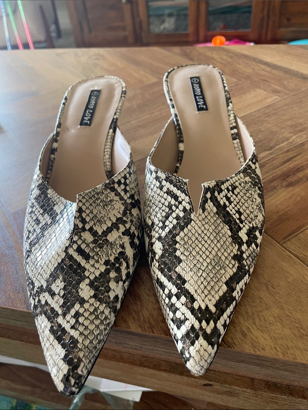 Snake-Print Pointed Mules in Black & Cream